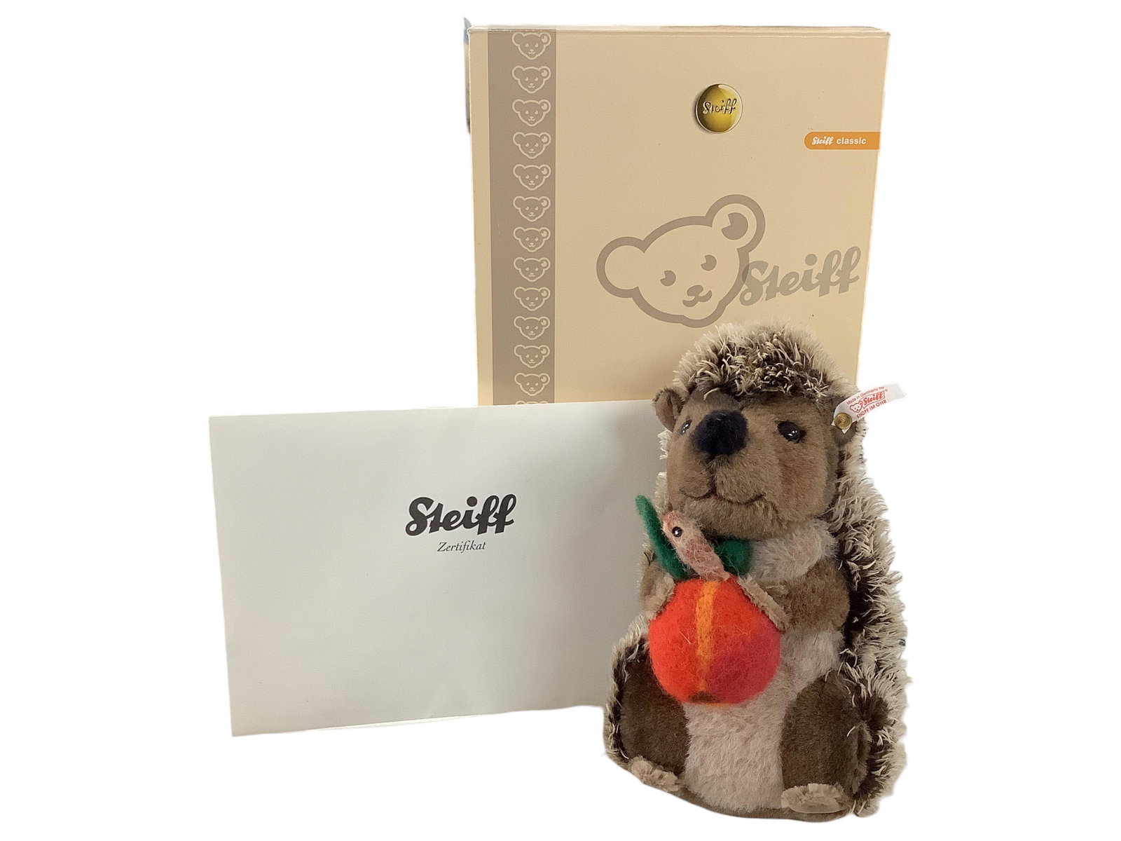Steiff Musical ìSigi the Hedgehogî in Box: Steiff Musical ìSigi the Hedgehogî in Box ìSigiî is #417 of limited edition of 2008 pieces. He has an apple with a worm, is 8î tall, plays ìMust I, Thenî & moves his