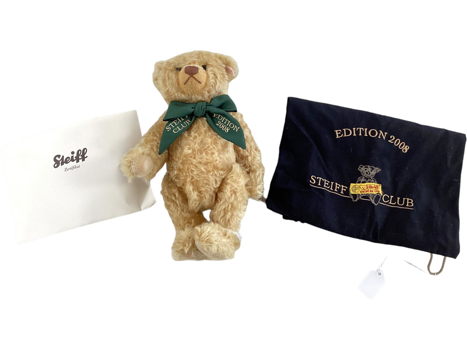 2008 Steiff Club Annual Edition Bear: 2008 Steiff Club Annual Edition Bear This 12î gold blond bear is #01642 of the 2008 production. He has an embroidered green bow, comes with a storage bag, & has the button tag in his ear.
