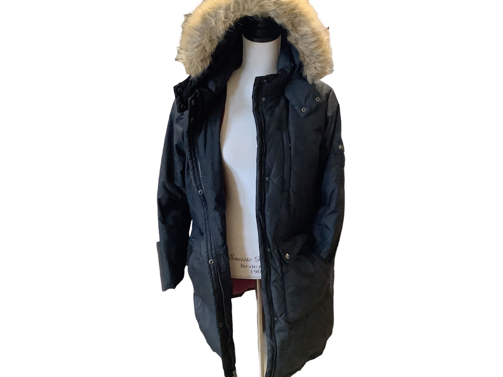 DKNY Down Jacket: DKNY Down Jacket Size M. Black in color with plum colored lining and faux fur lined hood. Zipper and button front. Hood is able to be detached. Has many cargo style pockets. Remove hood before machine