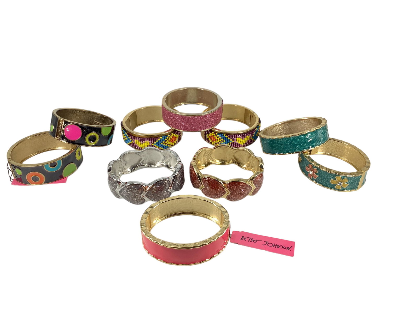 A Lot of Funky Bangles: A Lot of Funky Bangles 10 Betsey Johnson bangles. Hearts, flowers, polka dots, and lots of glitz. 2.25-2.5î in diameter.