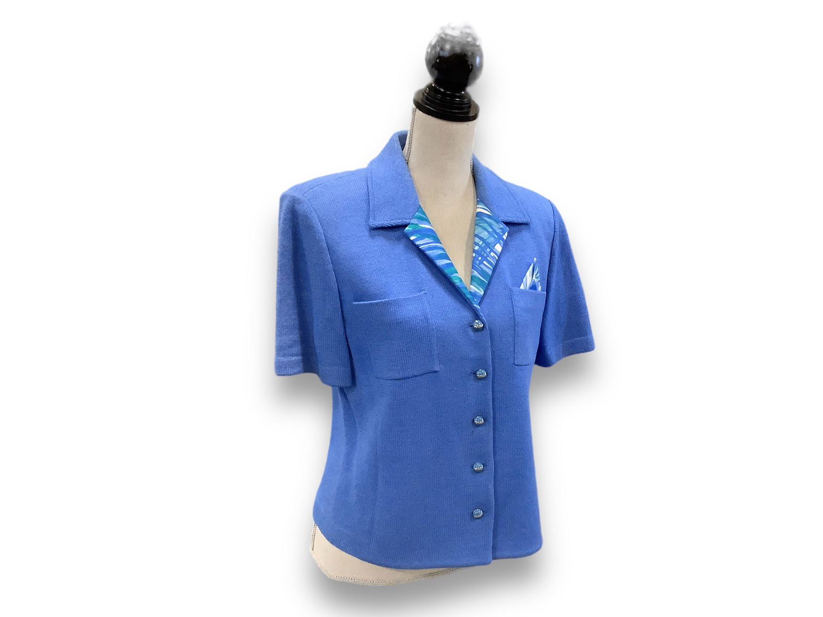 St. John Button Up Top: St. John Button Up Top Knit top, with enameled buttons accented with rhinestones, size (10) with a pocket square seven into the front pocket, perfect vacation look, pair with a ruffled white skirt or