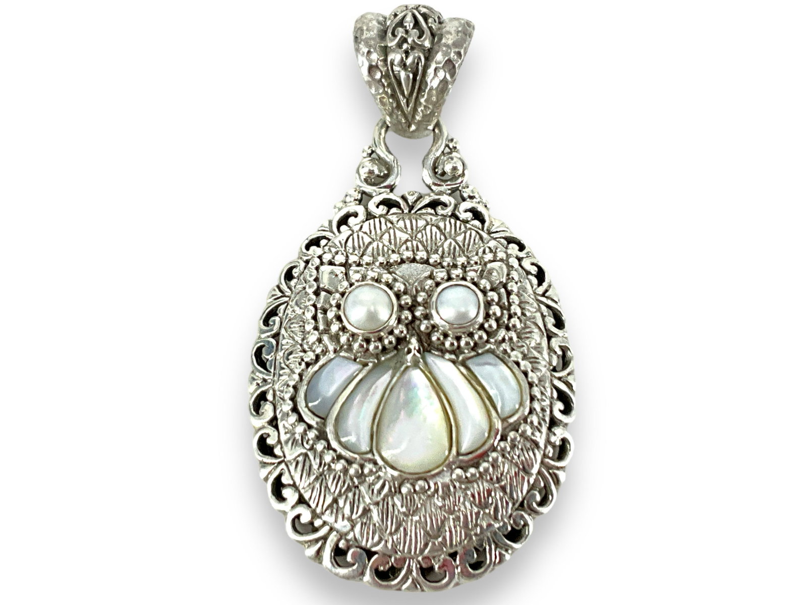 Sterling Silver Owl Pendant: Sterling Silver Owl Pendant With inlaid mother of pearl and small pearl rounds. Signed SARDA, stamped and tested 925/sterling silver, 52.25mm in length (including bail), modern design, like-new condit