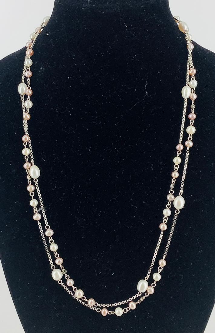 Sterling Silver Pearl Statement Necklace: Sterling Silver Pearl Statement Necklace Measuring approx. (52Ã®) in length with semi-round ringed white pearls measuring approx. (10.8mm in length) blush pink pearls measuring (approx. (5.8mm wide)