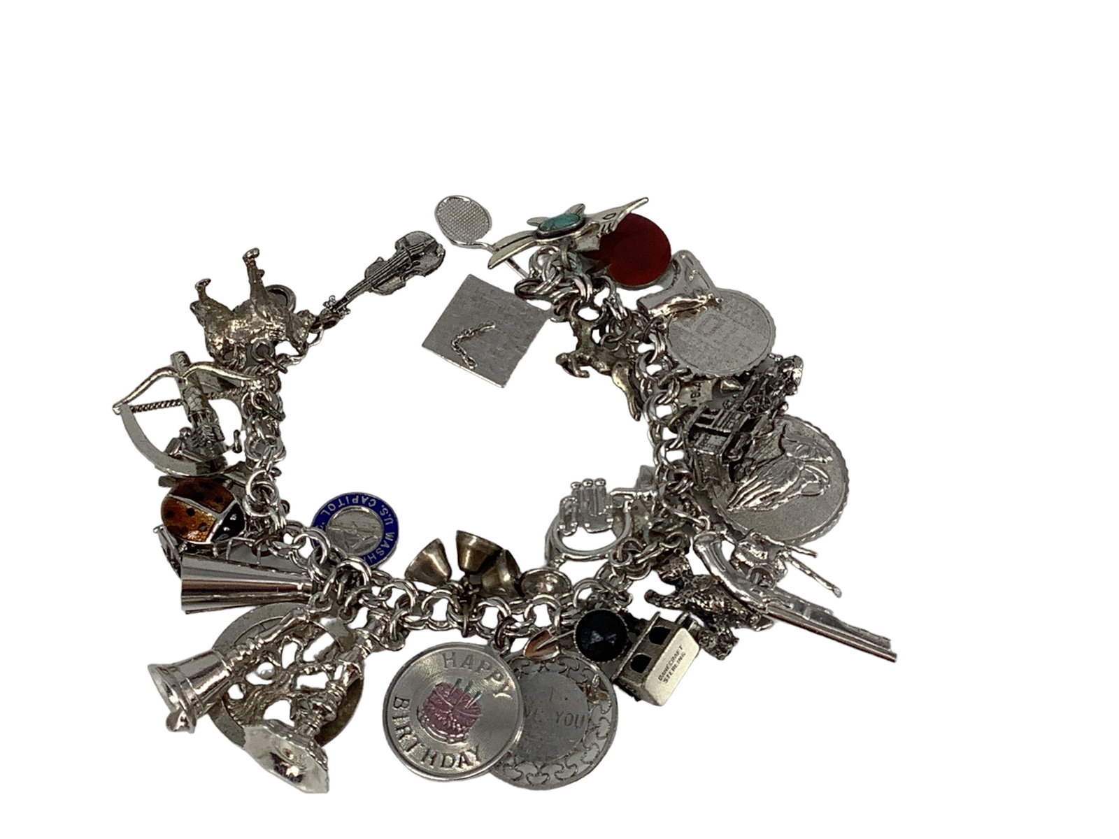 Charm Bracelet with Multiple Sterling Carms: Charm Bracelet with Multiple Sterling Carms Bracelet is 7 1/2î long and has the following charms: a marked ìDanecraft Sterlingî church, a marked ìSterlingî violin, marked 