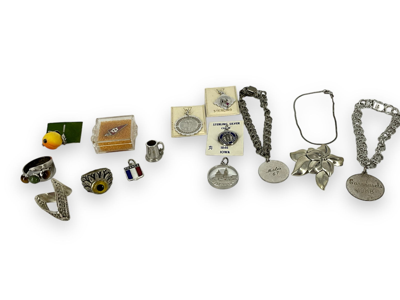 Misc Silver Jewelry Pieces: Misc Silver Jewelry Pieces Majority of lot has been tested to have LOWER than their marked silver content, bid with discretion. Lot contains charms and charm bracelets. Other, TESTED higher silver Ste