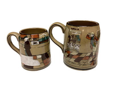 (2) Buffalo Pottery Deldare Ware Mugs: (2) Buffalo Pottery Deldare Ware Mugs Mugs have no chips or cracks. The larger of the two has wear on its glaze. Both pieces have some crazing.