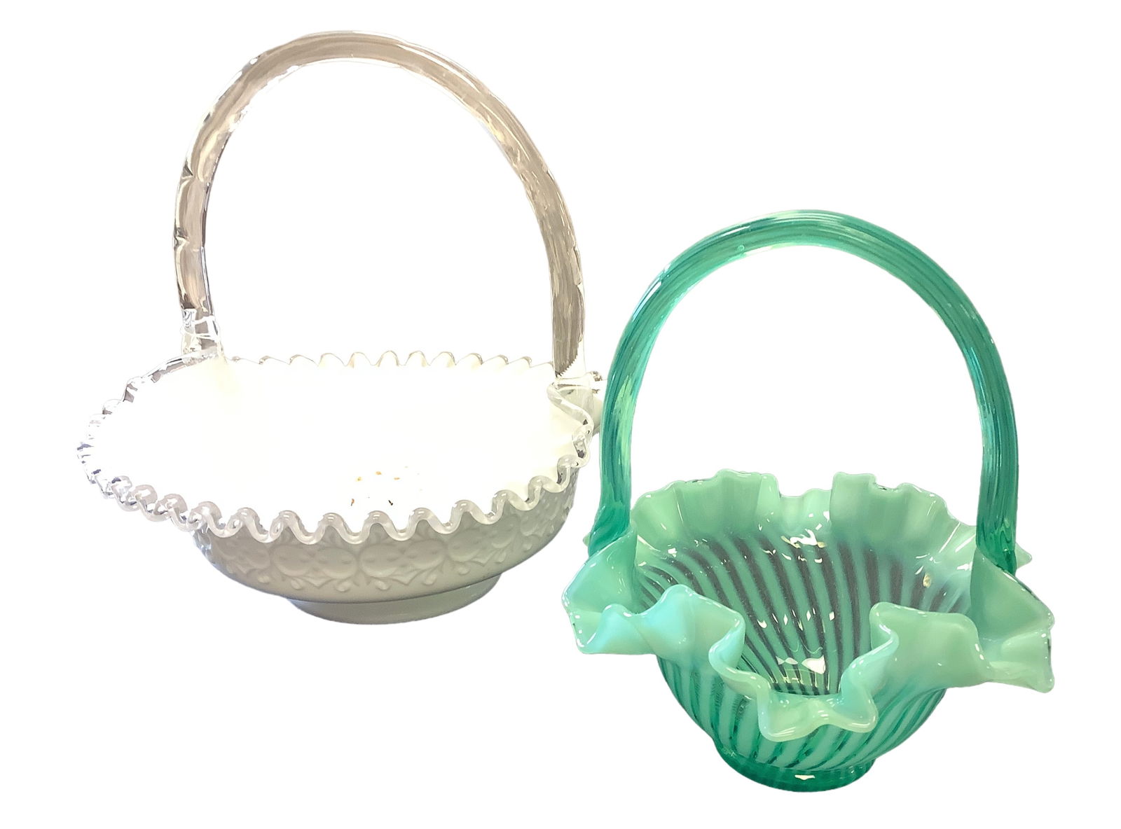 Pair of Fenton Decorative Baskets: Pair of Fenton Decorative Baskets Two charming Fenton baskets. Small green striped with fluted edge measures 7î in diameter. White milk glass with scalloped edge measures 10î in diameter. No
