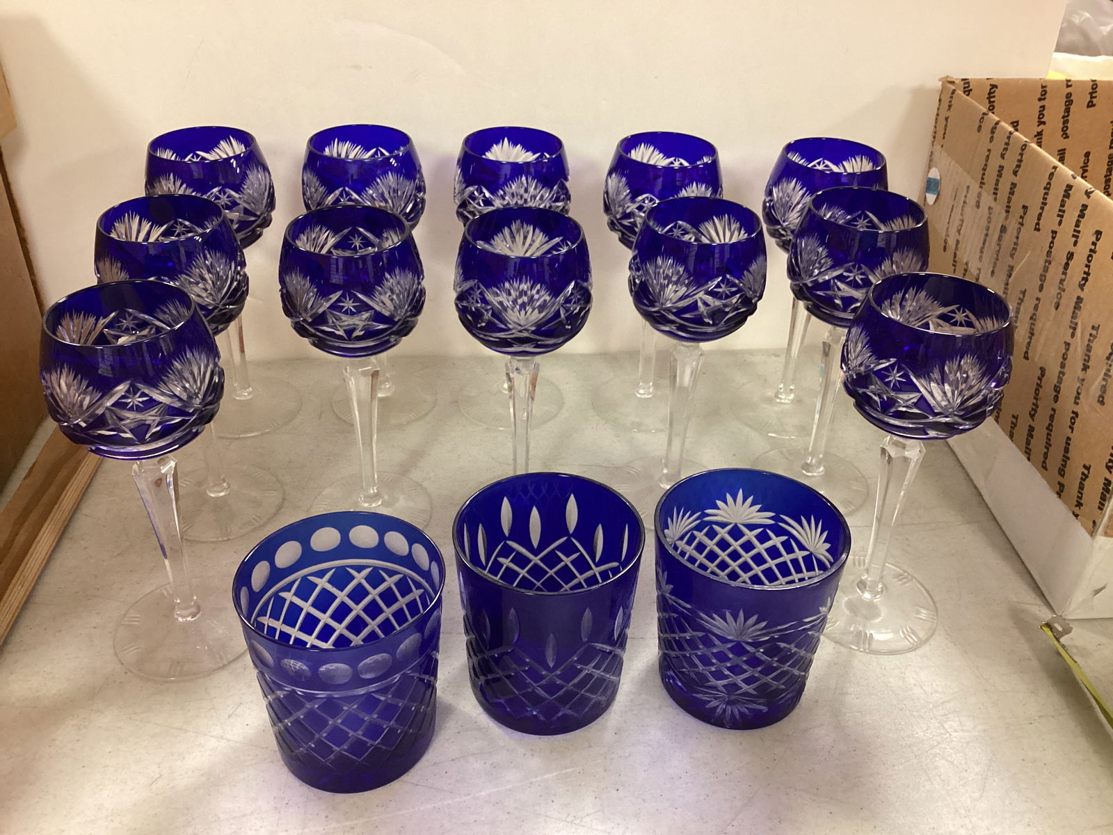 Cobalt Cut to Clear Wine Goblets and Old Fashions: Cobalt Cut to Clear Wine Goblets and Old Fashions 12 Cobalt Cut to Clear Wine Goblets & 3 Old Fashions. The wine goblets are 7 1/2î tall. No chips or cracks. No makers mark on any of the glasswar