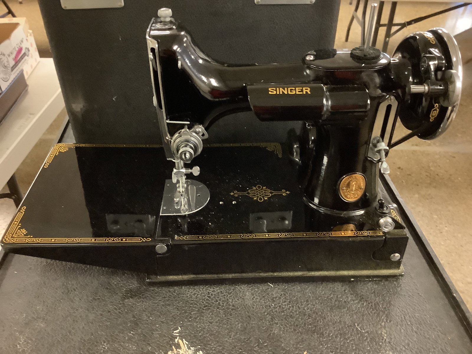 Singer Featherweight Sewing Machine: Singer Featherweight Sewing Machine 10î x 10î with attachments , Button Hold Attachment,Case included. Foot pedal included. # on machine AD 945801. Bobbin in office. (See Photos)