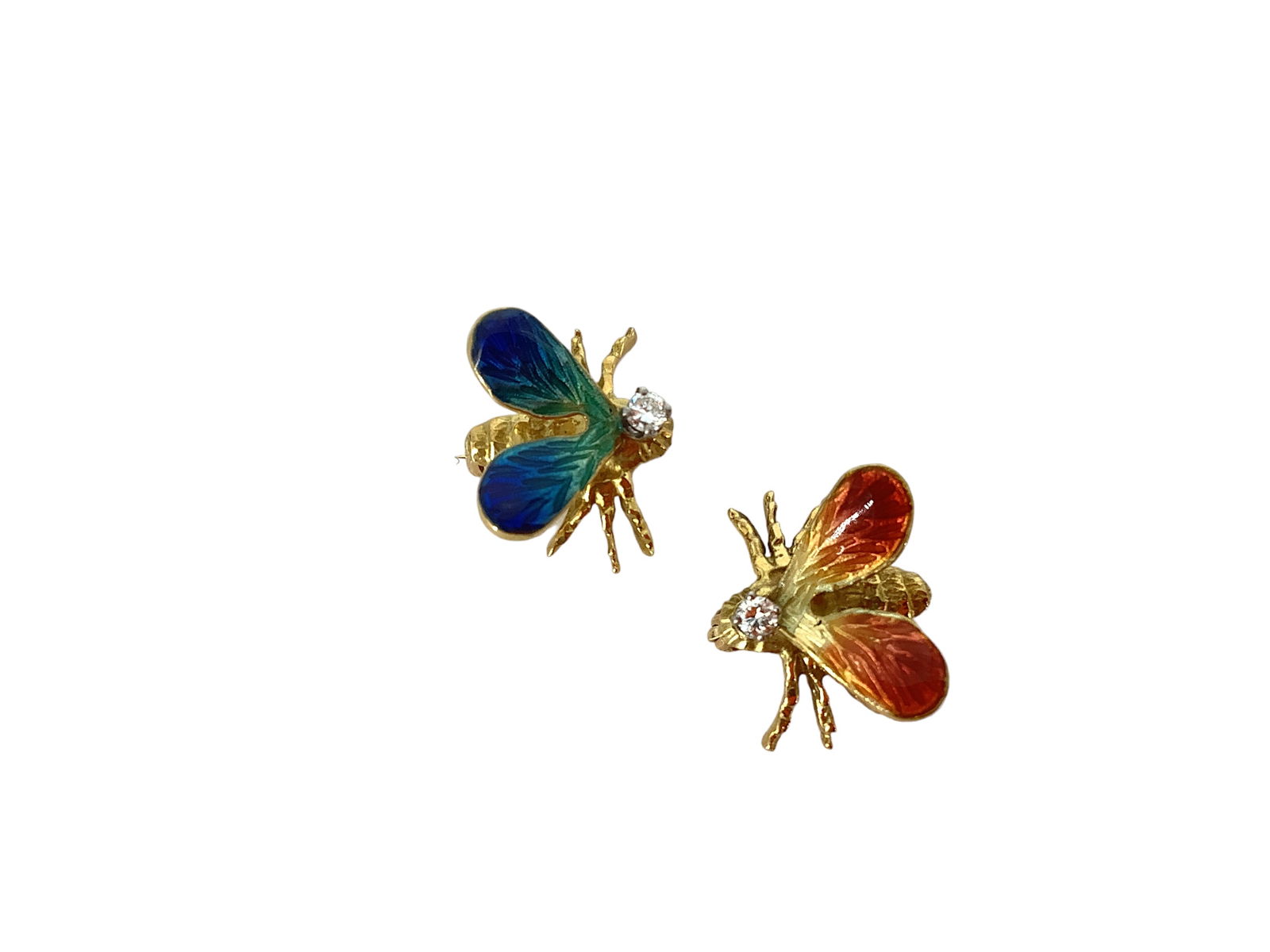 Two Small Darling Bee Pins: Two Small Darling Bee Pins Two pins testing as 16k gold, done in blue and orange enamel, pins are each approx 1/2î long and each have a tiny 2.1mm white clear stone on their top. Together, they w