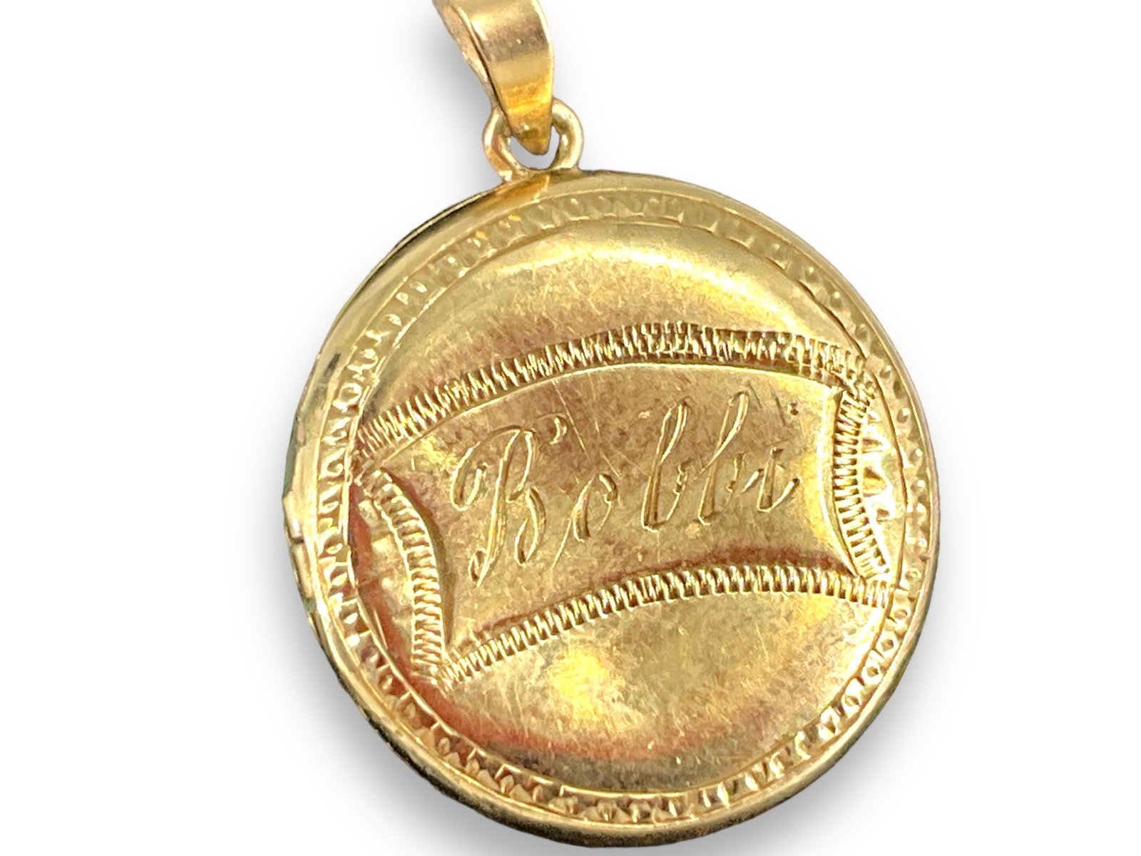 Small Gold Locket Marked ìBobbiî: Small Gold Locket Marked ìBobbiî Locket is marked ì14kî and tests closer to 13k, bid with discretion. Pendant locket opens, has spaces for 2 photos, is inscribed ìBobbiî 