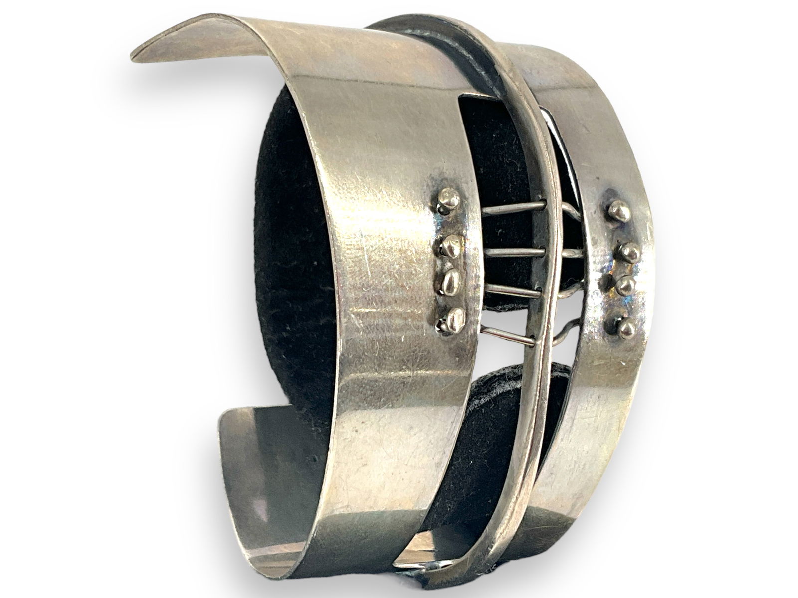 Signed Silver Cuff Bracelet: Signed Silver Cuff Bracelet Tested silver bracelet is hallmarked ìEd Wiener Sterlingî and has an open cuff modern design with a 5 1/4î inner circumference. Bracelet weighs 48.61 grams.