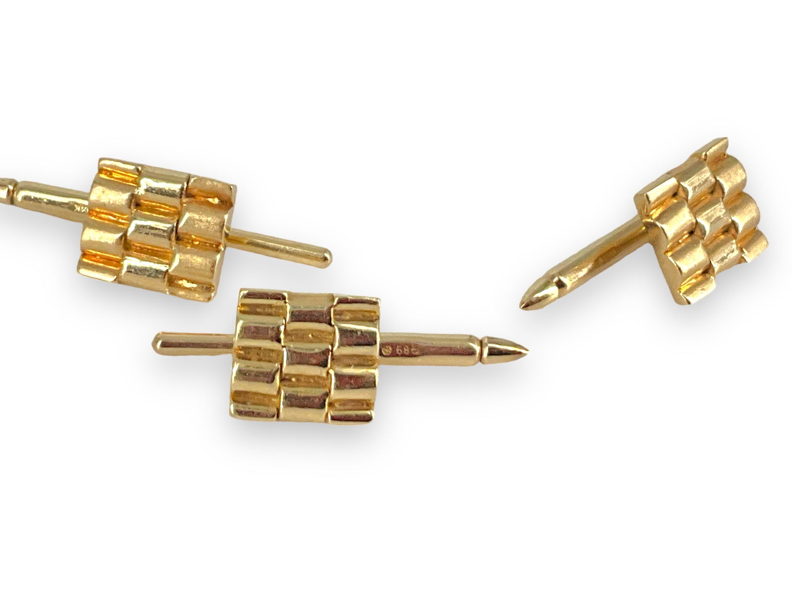 Spring-Back Tuxedo Studs in 14k: Spring-Back Tuxedo Studs in 14k Three Tuxedo studs are styled as a ìRolex Braceletî design, are marked ì14kî and tested gold, measure 1î in length and together weigh 8.59 gram