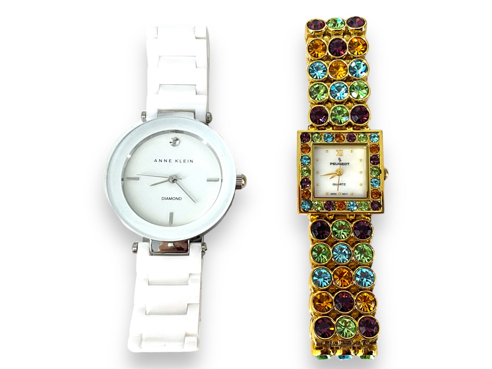 Peugeot Gold-Tone Watch with Multi-Color Glass Stones and Anne Klein White Quartz Watch: Peugeot Gold-Tone Watch with Multi-Color Glass Stones and Anne Klein White Quartz Watch Quartz watch in gold-tone metal with multiple color stones, watch is marked ìChina, Stainless Steel Back, J