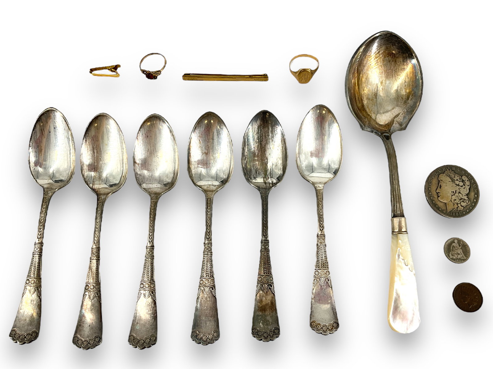 (7) Spoons (1) Penny (1) Dollar Coin (1) Dime (1) Clip (1) Bar Pin (2) Rings (1 of 11)