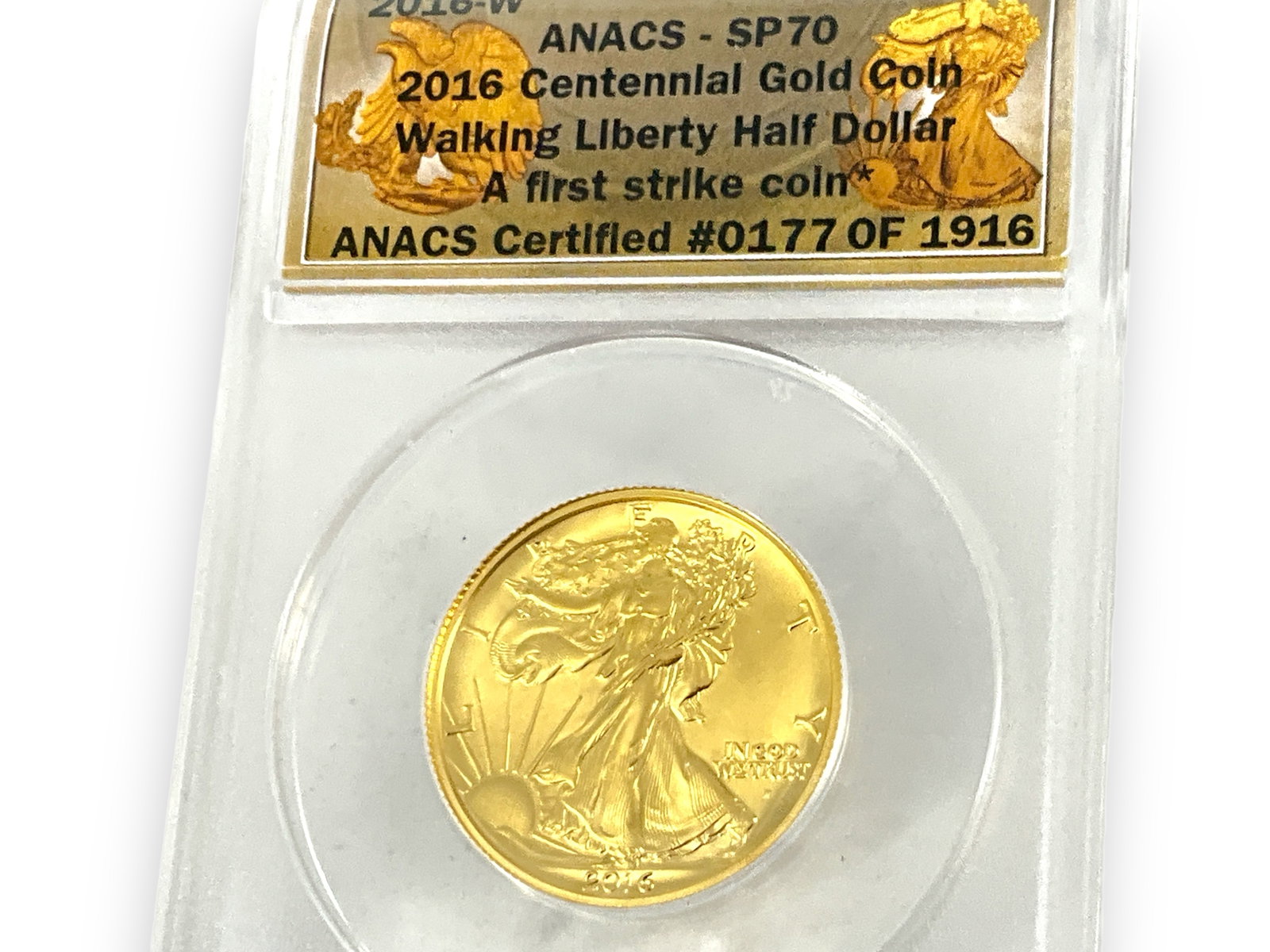 2016-W SP70 Walking Liberty 1/2oz. Gold Coin: * 2016-W SP70 Walking Liberty 1/2oz. Gold Coin In slab from ANACS (177/1916), 1/2 oz. fine gold total weight, Walking Liberty half dollar coin design, graded SP70. ***This lot is tax exempt***