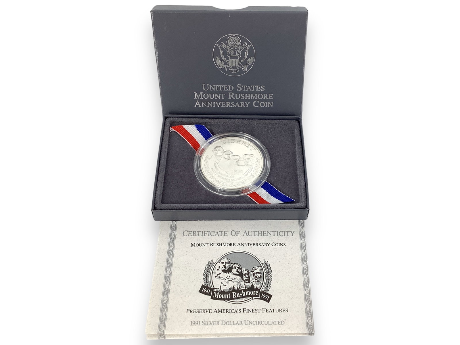 U.S. Commemorative Silver Uncirculated Dollar Coin: * U.S. Commemorative Silver Uncirculated Dollar Coin 1991-P commemorative Mount Rushmore Anniversary silver dollar coin, 90% fine silver composition, not professionally graded, uncirculated condition,