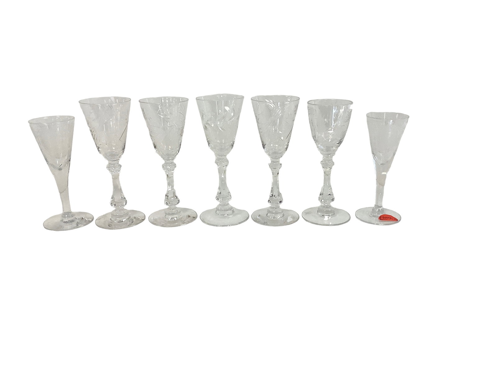 Cordials: Cordials Lot of 7. Includes (2) Tiffin with Classic etch (one with small base nick), and (5) Cambridge cut cordials.