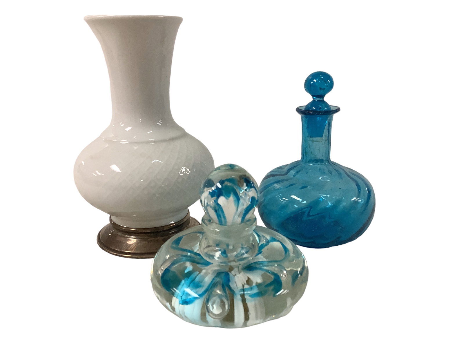 Perfume Decanters and Porcelain Vase: Perfume Decanters and Porcelain Vase Lot of 3. Hand blown Perfume decanters measure 4î & 6î. White Porcelain Vase with silver trimmed base stands 7î in height. Vase is marked on the bot