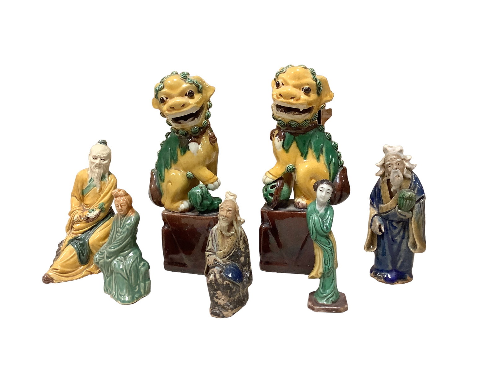 Vintage Foo Dog Set and Chinese Mud Men: Vintage Foo Dog Set and Chinese Mud Men Foo Dogs glazed yellow, green, and brown measures 7î inches in height have several broken teeth and a missing paw. Mud Man figurines measures 3î to 5&
