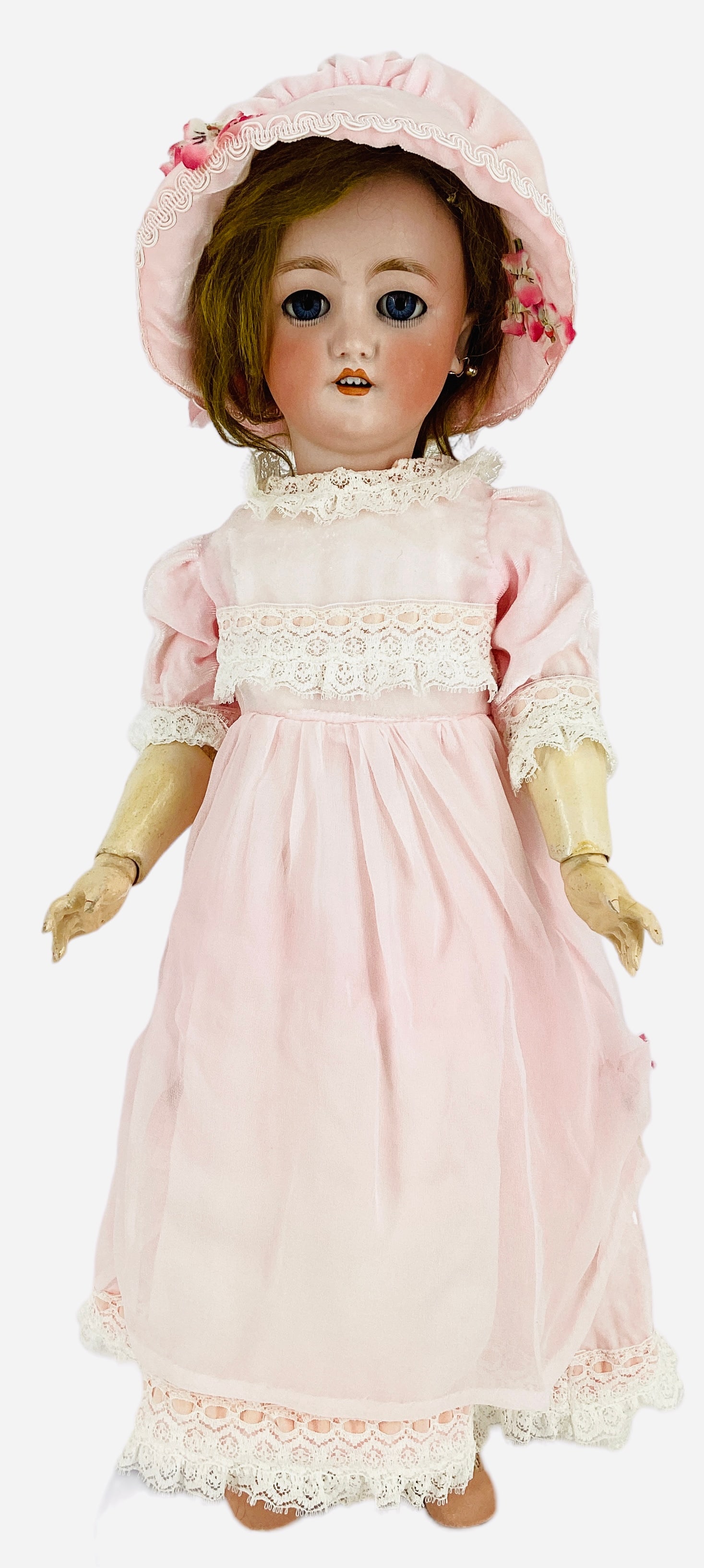 C.M. Bergmann Simon & Halbig bisque socket head girl.: C.M. Bergmann Simon & Halbig bisque socket head girl. 21" doll with mohair wig, glass sleep eyes with eyelashes, pierced ears, open mouth with teeth, on jointed composition body. Bisque cracks behind