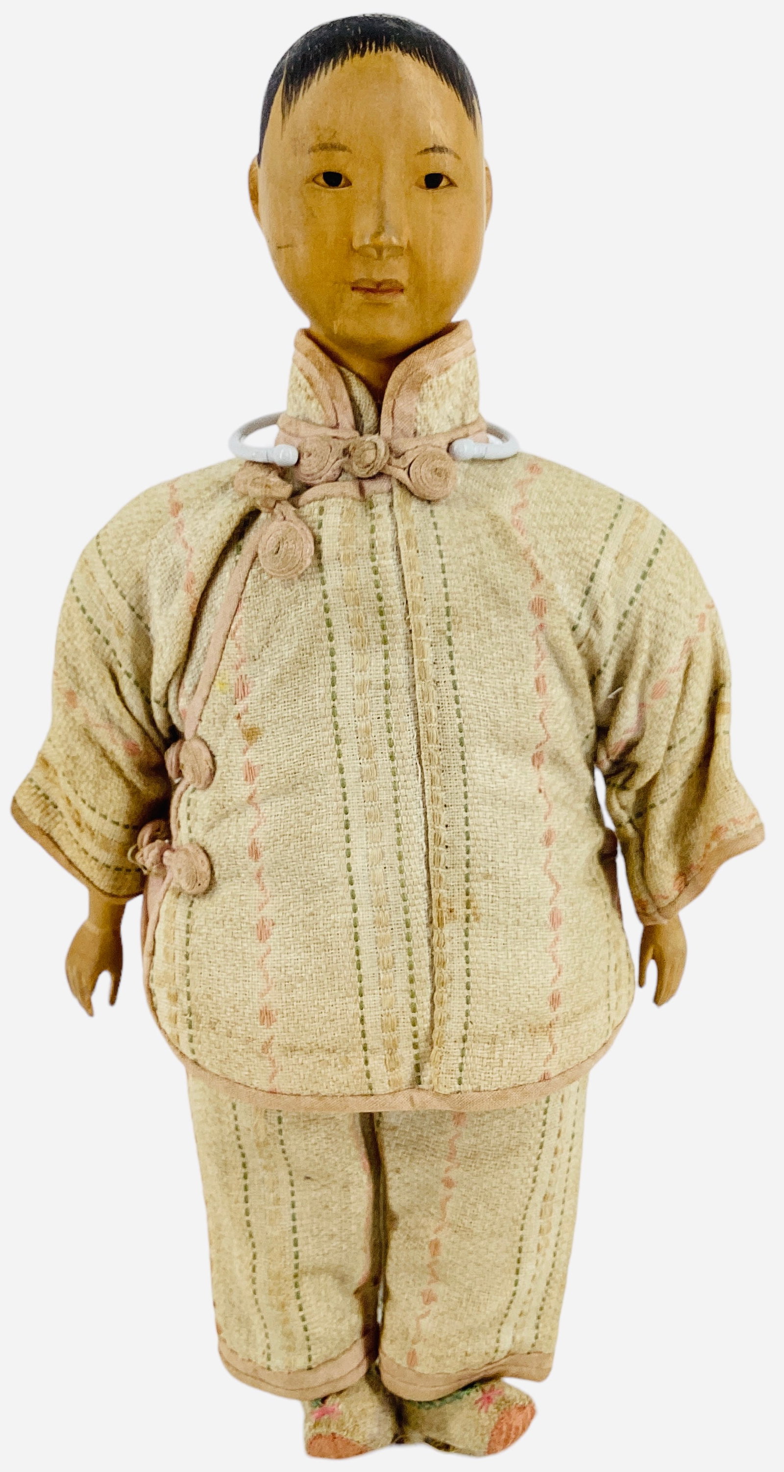 Door of Hope doll.: Door of Hope doll. 9" girl with carved wood flange head, painted hair and facial features, intaglio eyes, on cloth body with wood lower arms. Costume has overall soiling and fading, left shoe is torn,