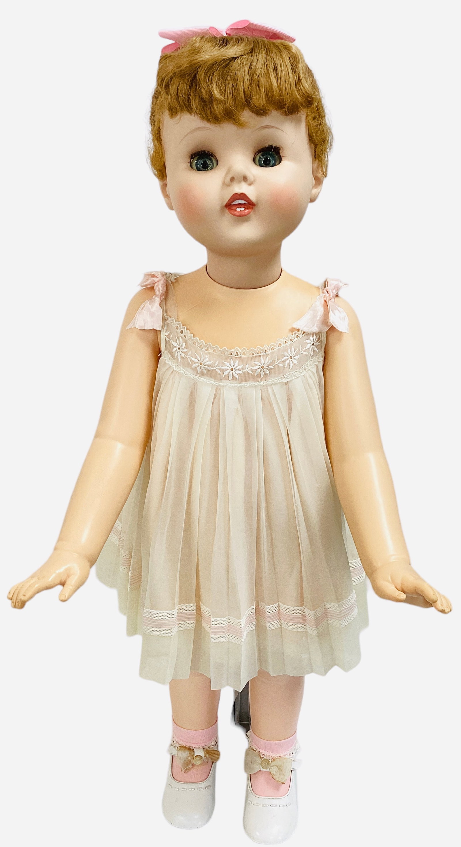 American Character "Toodles" girl.: American Character "Toodles" girl. 30" vinyl doll with rooted hair, "follow you" sleep eyes with eyelashes, molded and painted open mouth with teeth, on five-piece body. Toodles wears her original dre