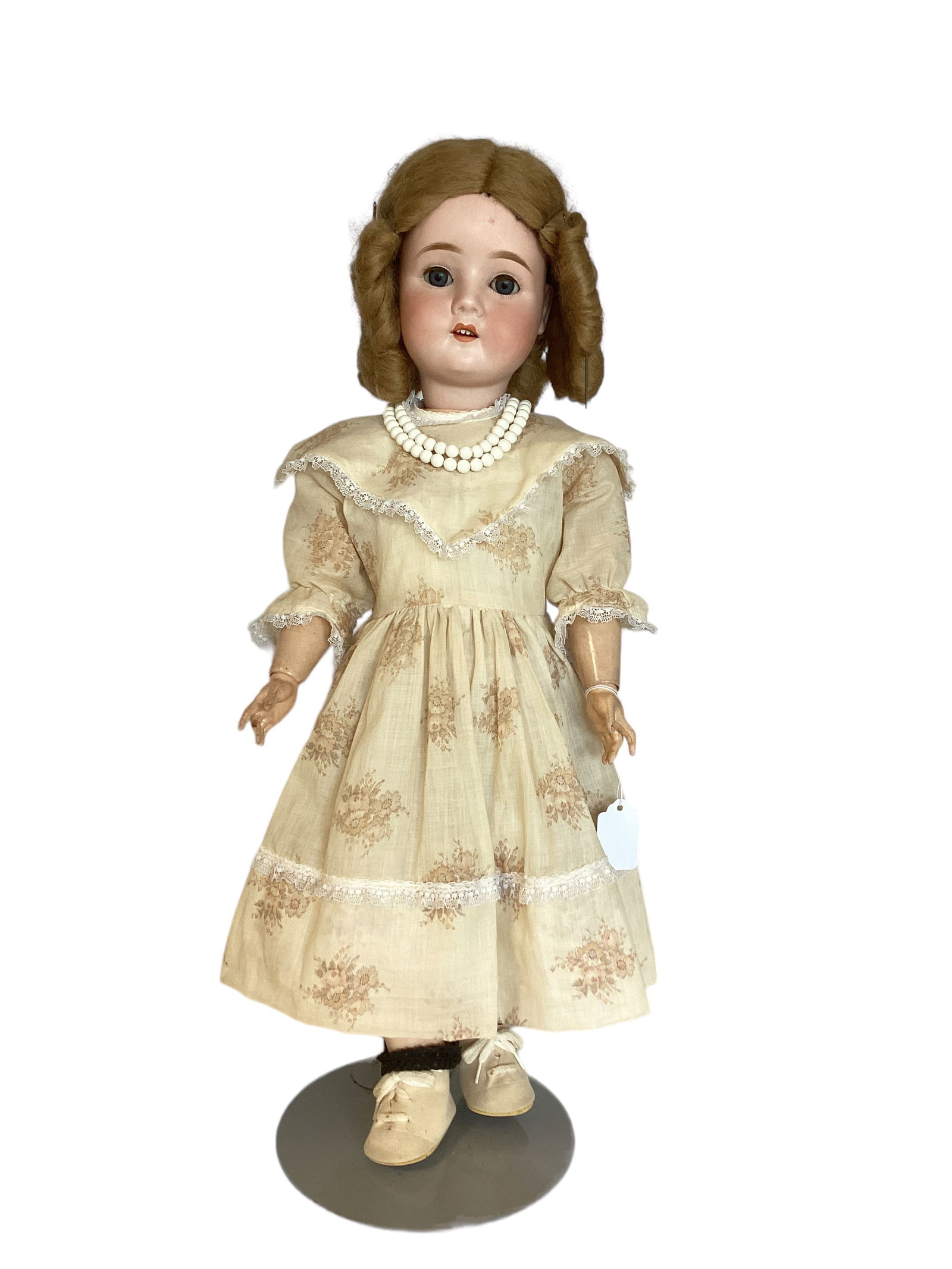 Gans & Seyfarth bisque socket head girl.: Gans & Seyfarth bisque socket head girl. 24 1/2" doll with mohair wig, glass sleep eyes with eyelashes, open mouth with teeth, on jointed composition body, nicely dressed. Wig glued on and not removed