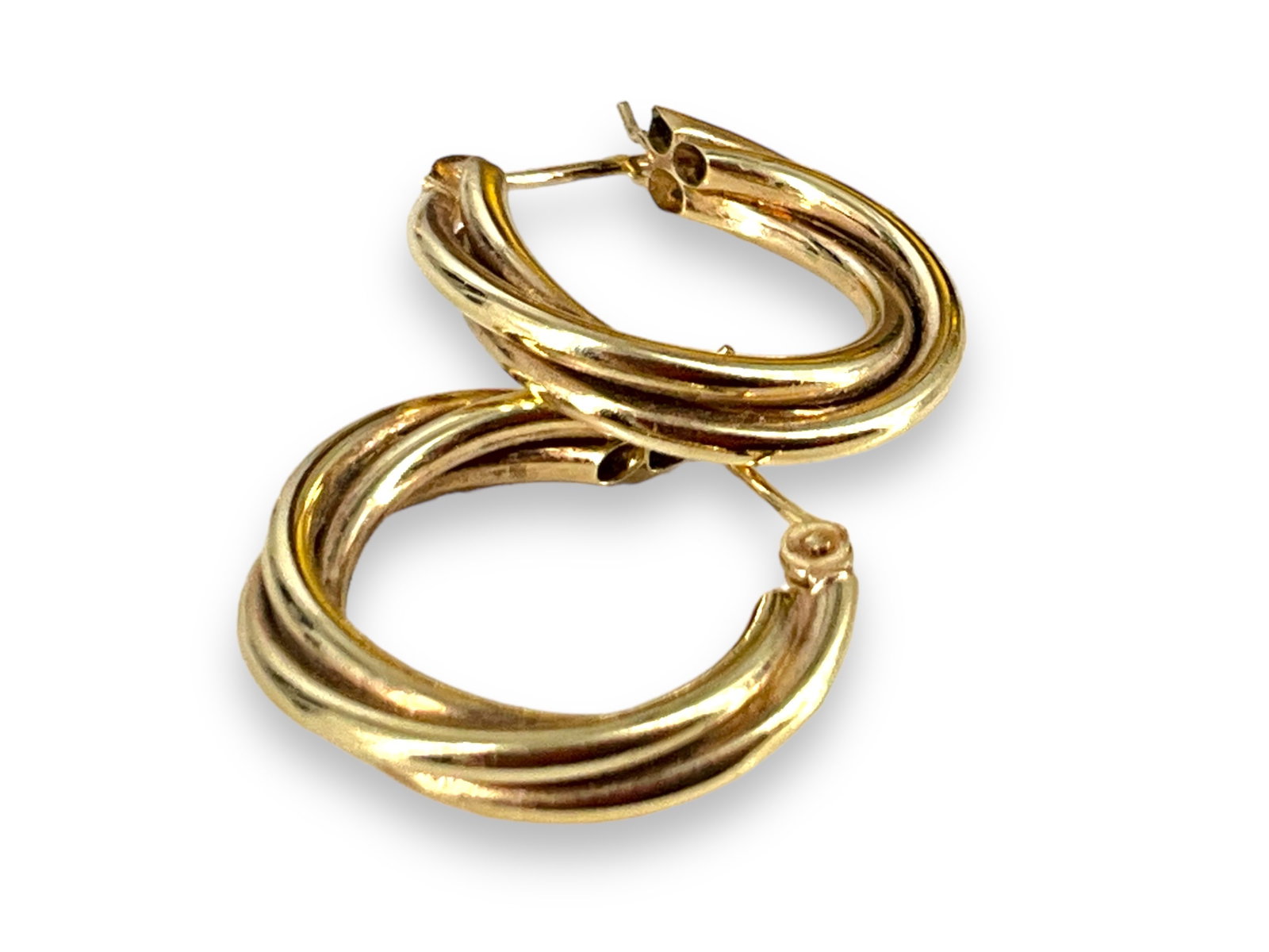 14kt Yellow Gold Hoop Earrings: 14kt Yellow Gold Hoop Earrings Measuring (0.64î) in length polished design with tubes of gold that wrap around each other, stamped and tested (0.9 grams tw).