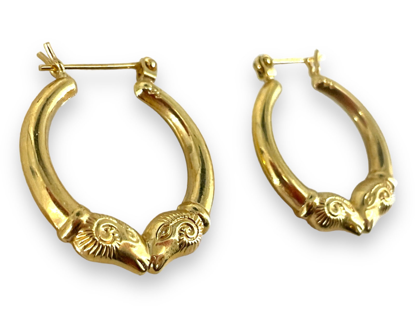 Pair of 14kt Gold Earrings: Pair of 14kt Gold Earrings Pierced style, 25.75mm in size, 2.2 grams total weight, stamped and/or tested 14kt yellow gold.