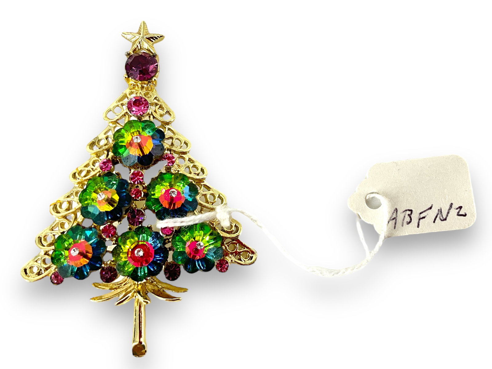 Darling Vintage Christmas Tree Pin: Darling Vintage Christmas Tree Pin 65.5mm x 43.75mm in size, adorned with multi-colored crystals, Christmas motif, festive design. Unsigned.