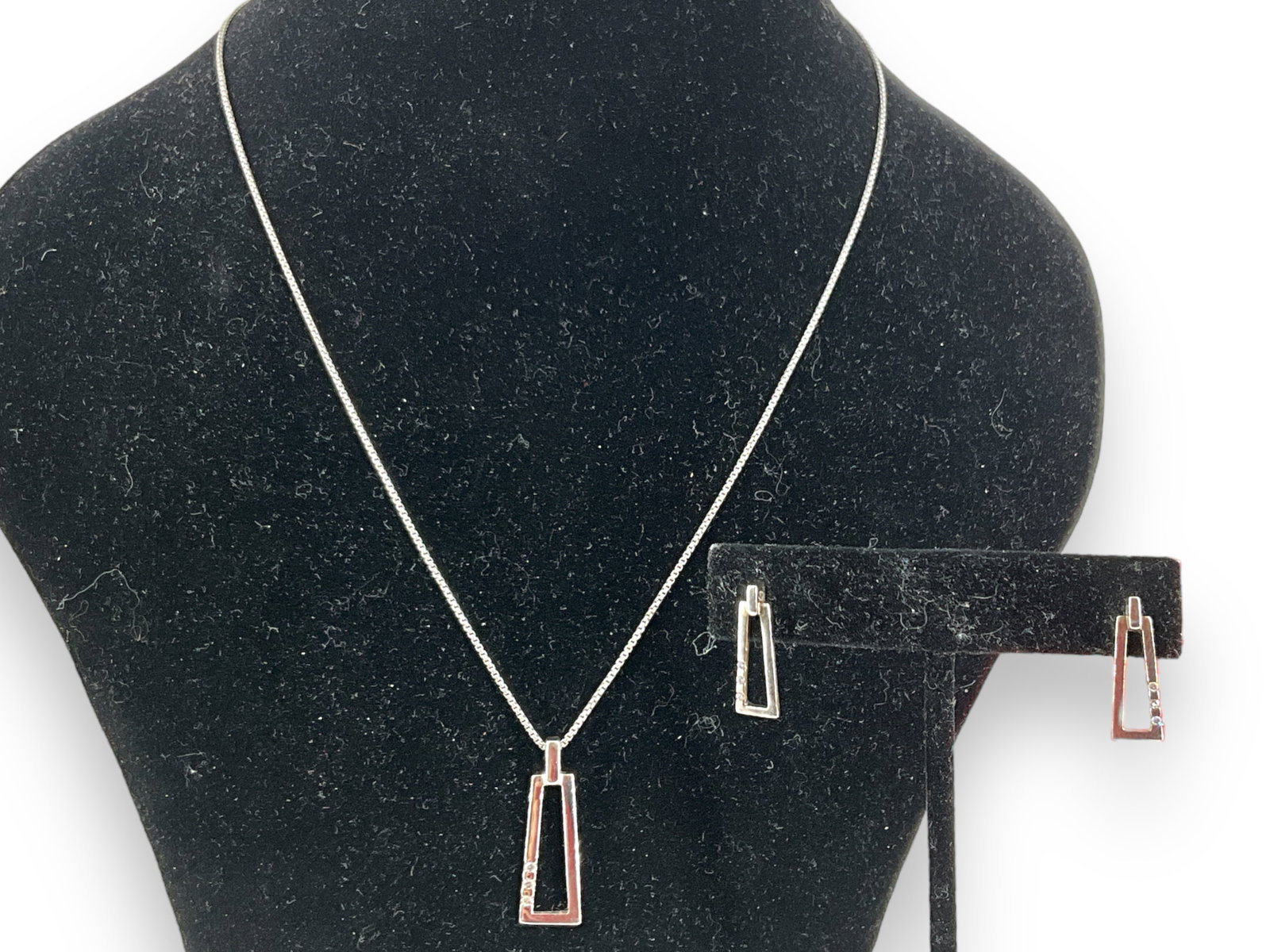 Sterling and Diamond Jewelry Set: Sterling and Diamond Jewelry Set Stamped and tested sterling silver/925, 0.225 troy ounces total weight. 19.25mm earrings on posts (pierced style), 28.25mm pendant on 18" princess length chain necklac