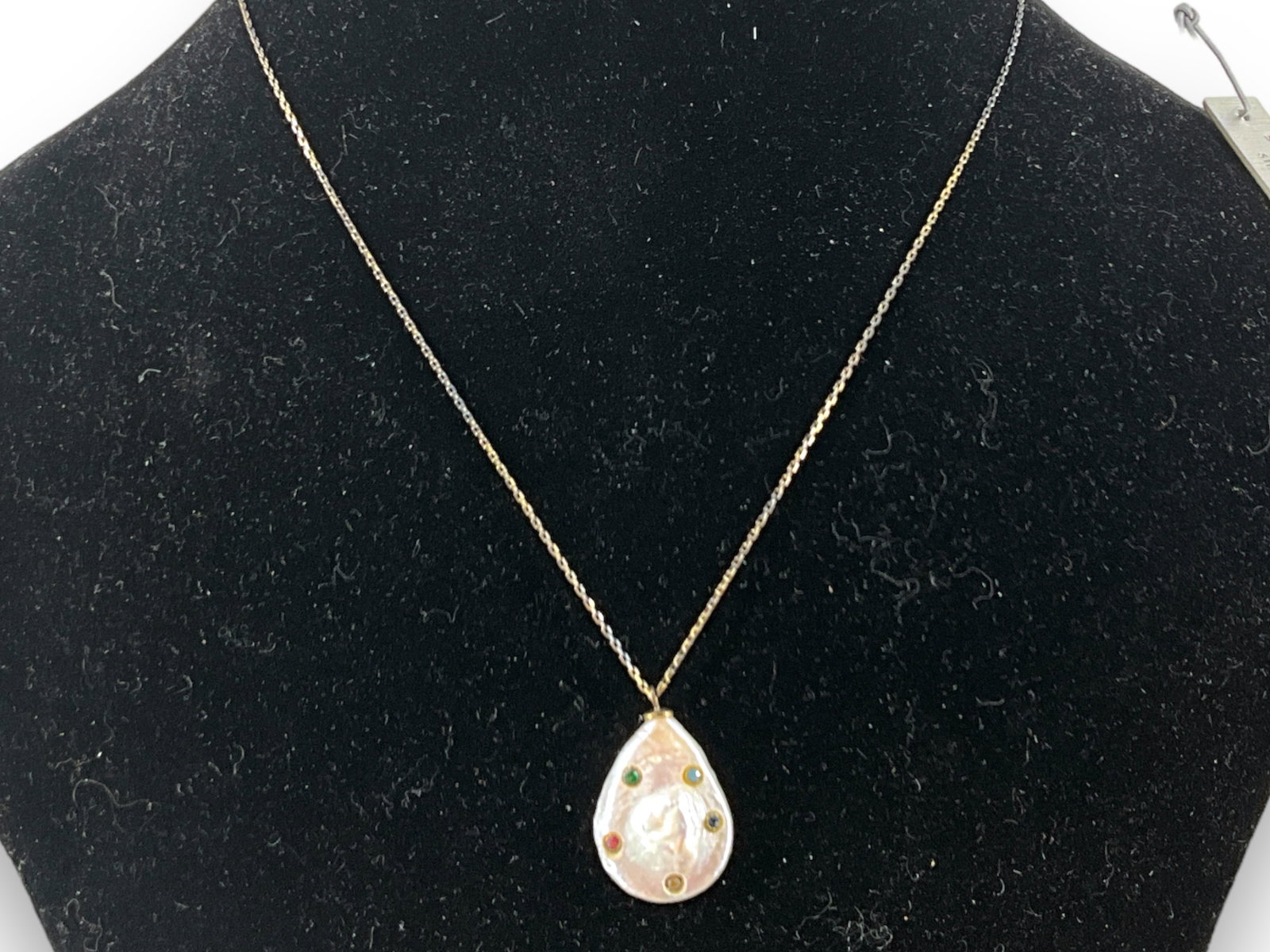 Unique Gold Over Sterling Chain With a Pearl Pendant: Unique Gold Over Sterling Chain With a Pearl Pendant Chain measuring (14î - 17î) in length containing a (24.4mm) semi-baroque pearl pendant accented with five bezel set synthetic gemstones, 