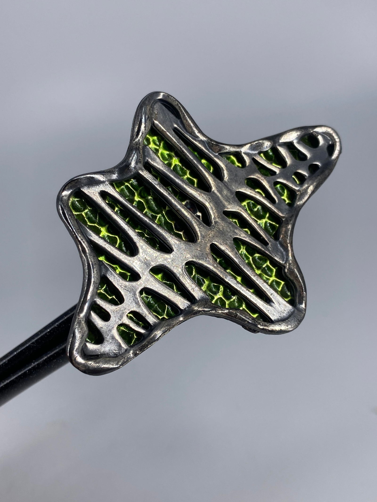 Unique Coro Brooch: Unique Coro Brooch Fun design featuring an asymmetrical star motif with a textured green enameled center and silver tone base medal overlay, singed on the reverse.