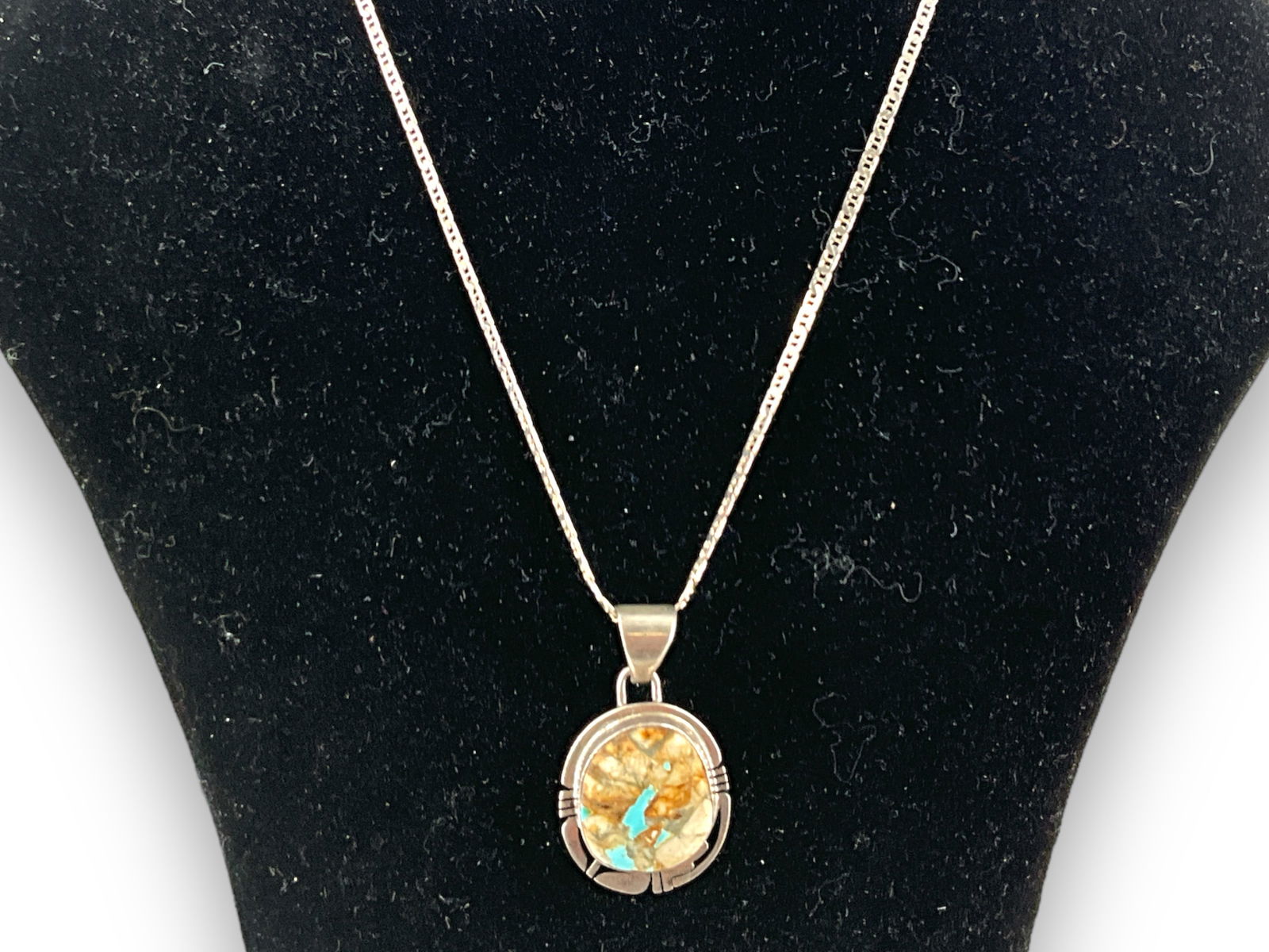 Sterling Silver Southwestern Style Pendant: Sterling Silver Southwestern Style Pendant Polished chain measuring (18î) in length containing a (1.40î) slide pendant with a semi-precious center stone in a bezel setting, signed ìP. S