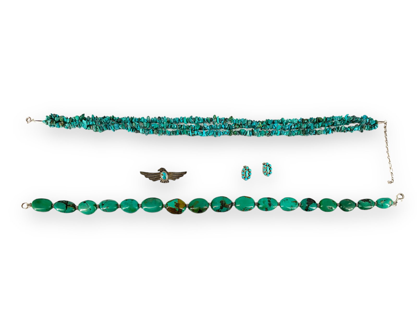 Turquoise and Silver Pieces: Turquoise and Silver Pieces Pin has an eagle design with a center, bezel-set turquoise, is 2 1/4î long and tests silver, weighs 4.80 grams. Also, there are silver and turquoise clip earrings @ 3/