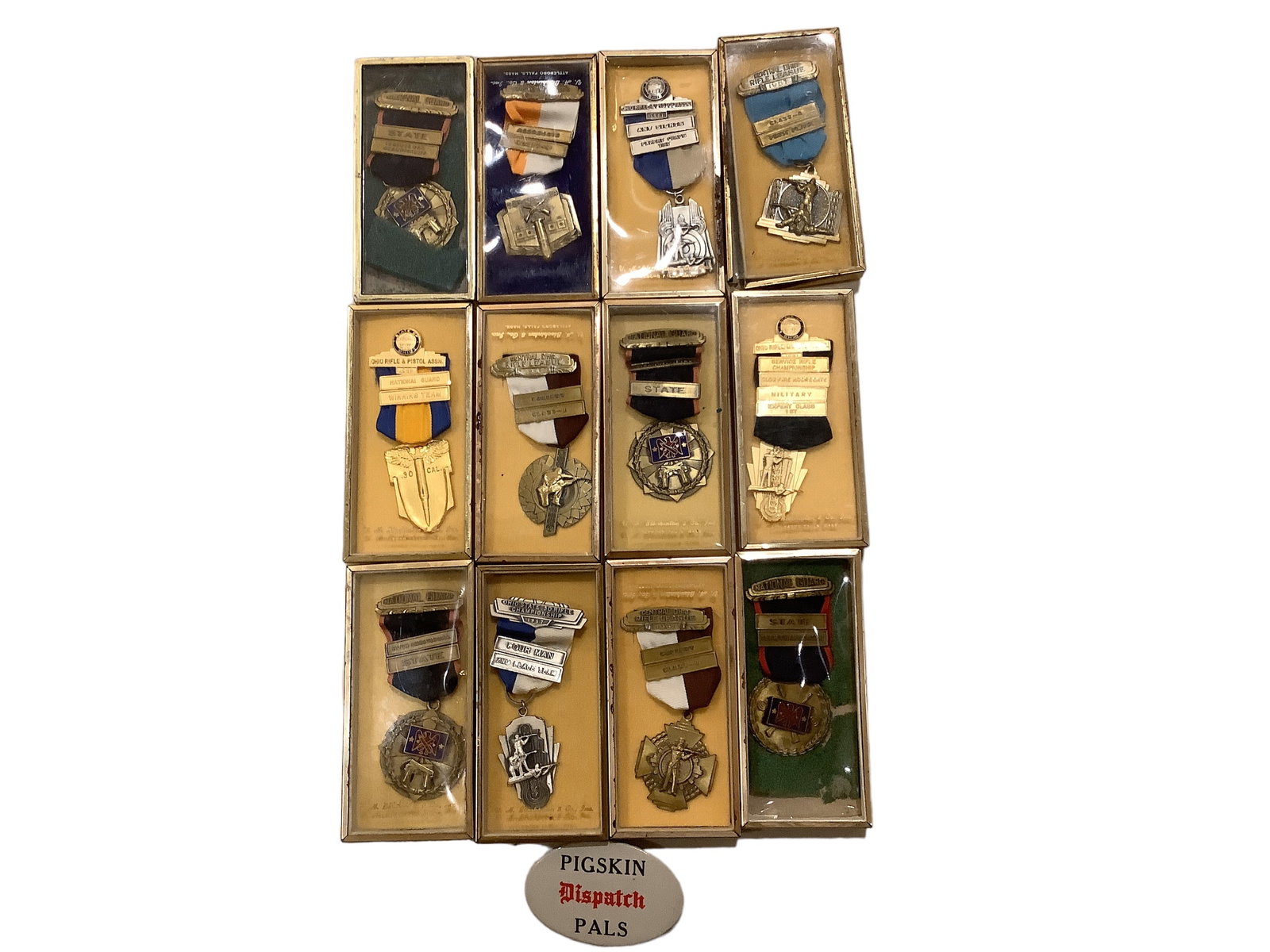 Mix of National Guard & Central Ohio Rifle League Medals in Boxes: Mix of National Guard & Central Ohio Rifle League Medals in Boxes There are 12 medals in boxes