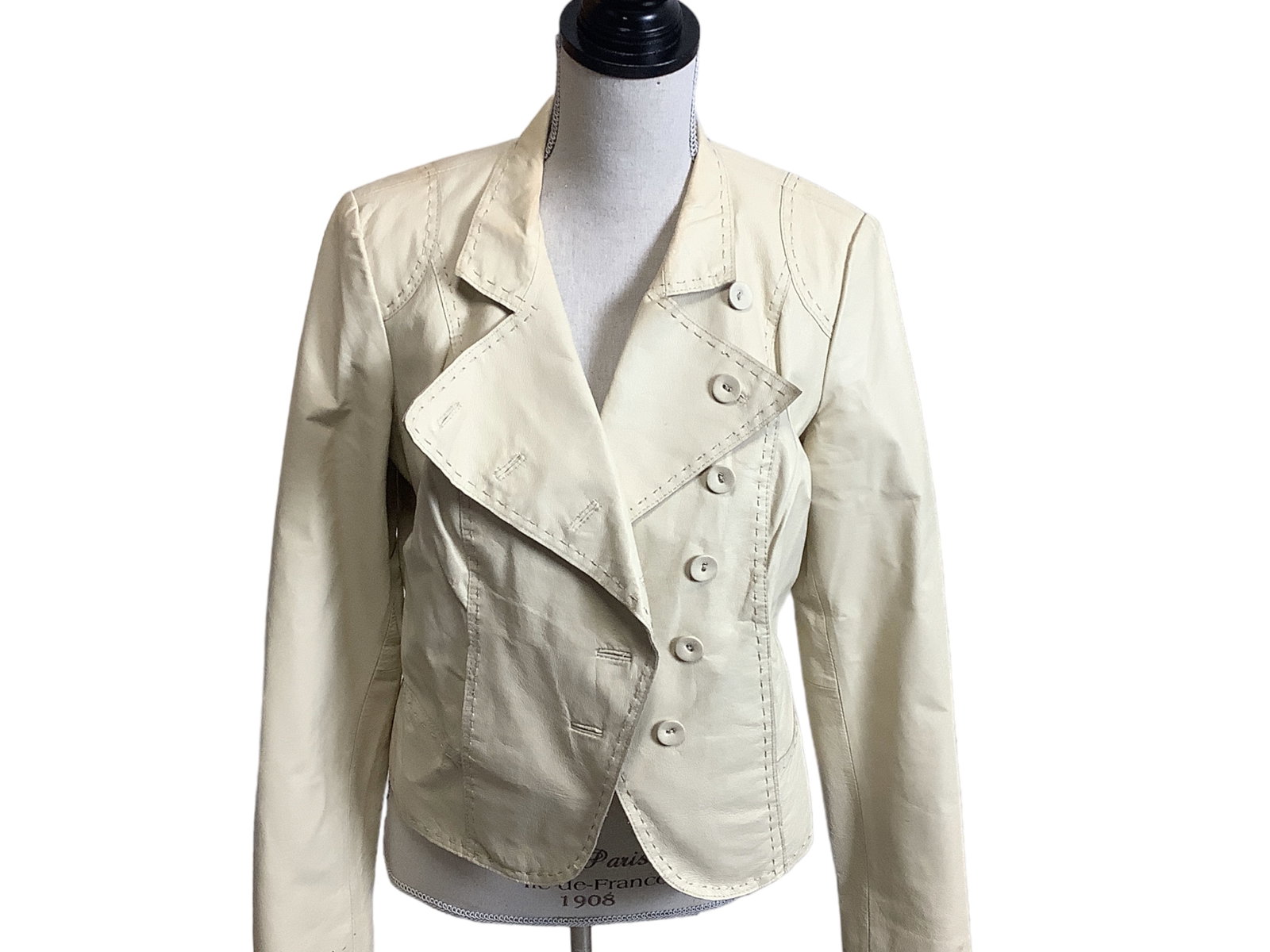 Newport News Leather Jacket: Newport News Leather Jacket Size (10), leather exterior, cream color with leather covered buttons, gently used, one blemish of note, pen mark on front, makeup mark on collar.