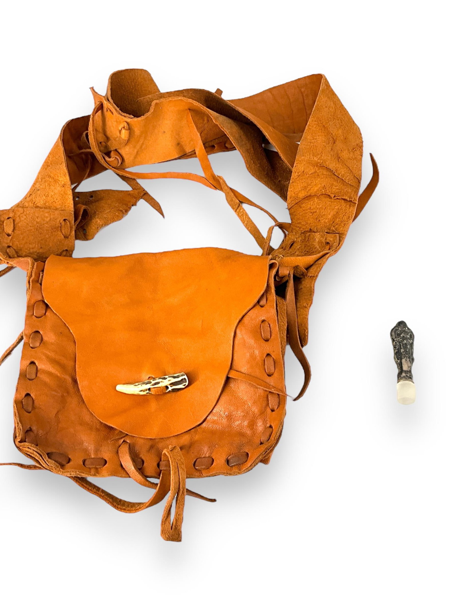 Rawhide Purse Pouch and Silver Receptacle: Rawhide Purse Pouch and Silver Receptacle Rawhide purse is a rust color, measures approx 7î wide, 7î tall and 2î deep, has a decorative bone type accent on over-flap, interior has two p