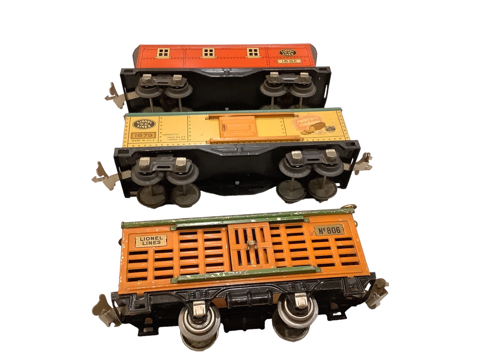 Lionel Prewar O Gauge #806 Stock Car, #1679 Baby Ruth Box Car and #1682 Caboose.: Lionel Prewar O Gauge #806 Stock Car, #1679 Baby Ruth Box Car and #1682 Caboose.