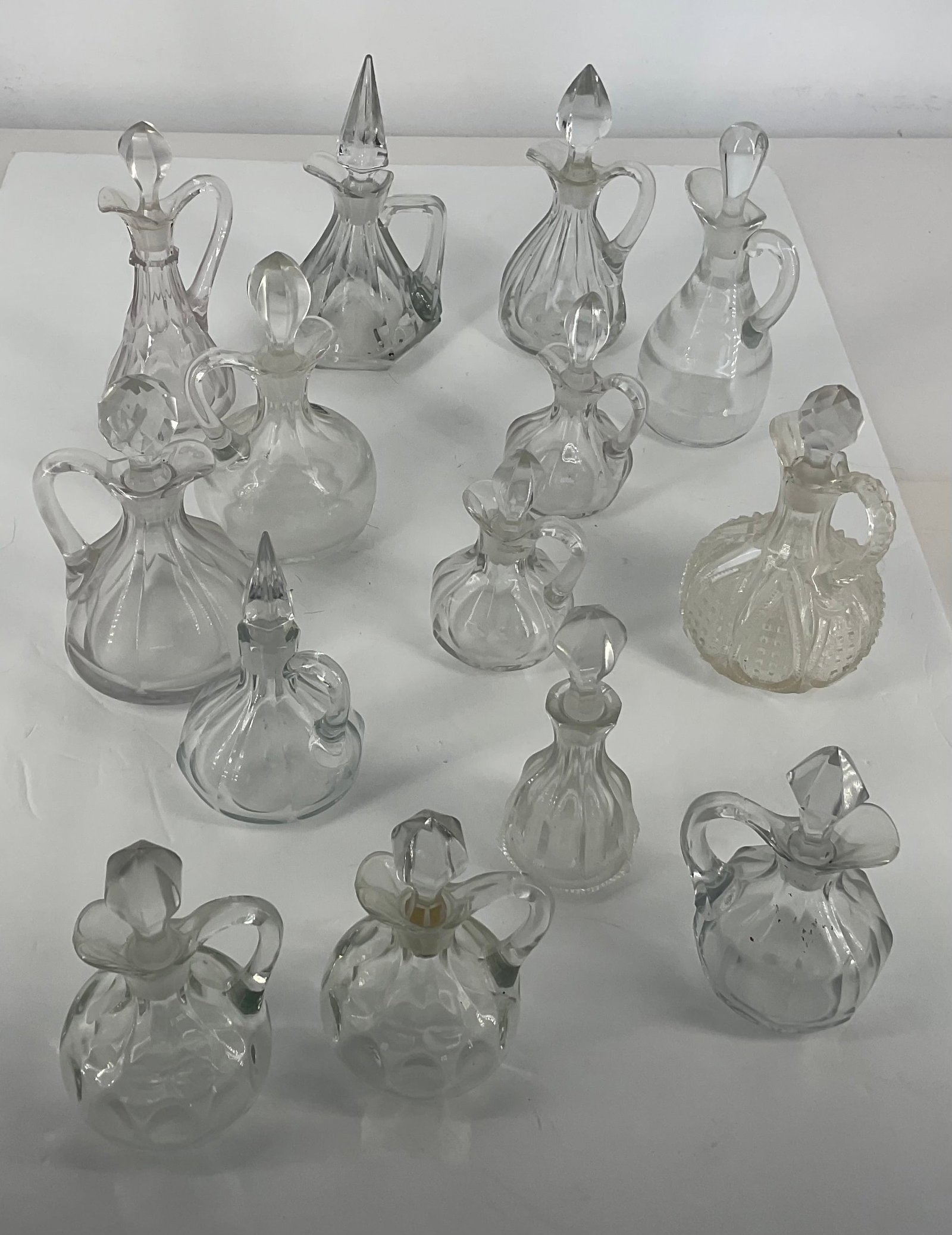 Heisey Glass: Heisey Glass 14 Cruets Pair of Puritan 2.5 oz . Peerless individuals drink decanter #1 stopper.. Saturn 6 oz with correct stopper. Fancy loop 6 oz with faceted stopper. Plain panel recess 6î face