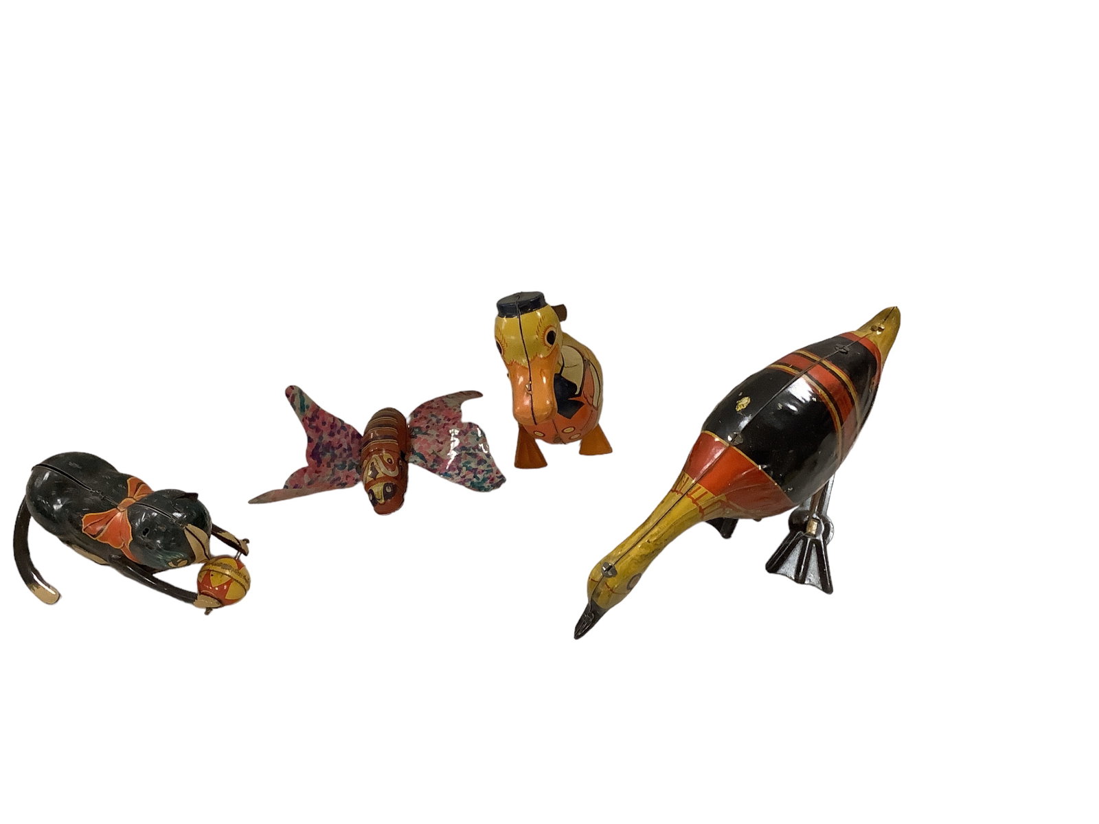 Vintage Metal Wind-Up Toys: Vintage Metal Wind-Up Toys Lot of (4) including a butterfly with a 3îL metal body and thin, hard plastic wings, a 5.25îL kitten playing with a ball, it is missing an ear and the wind-up key,