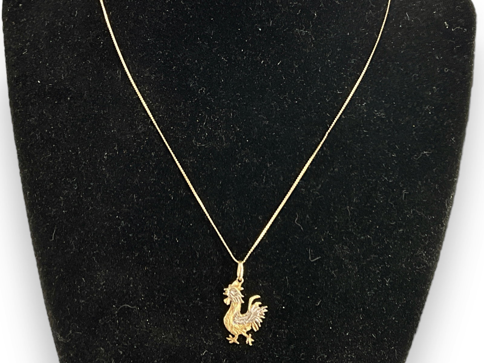 14kt Yellow Gold Necklace and Rooster Pendant: 14kt Yellow Gold Necklace and Rooster Pendant 16" choker length chain (kinked) - chain and pendant 1.8 grams total weight, spring ring clasp, figural rooster pendant approximately 19.5mm in length.