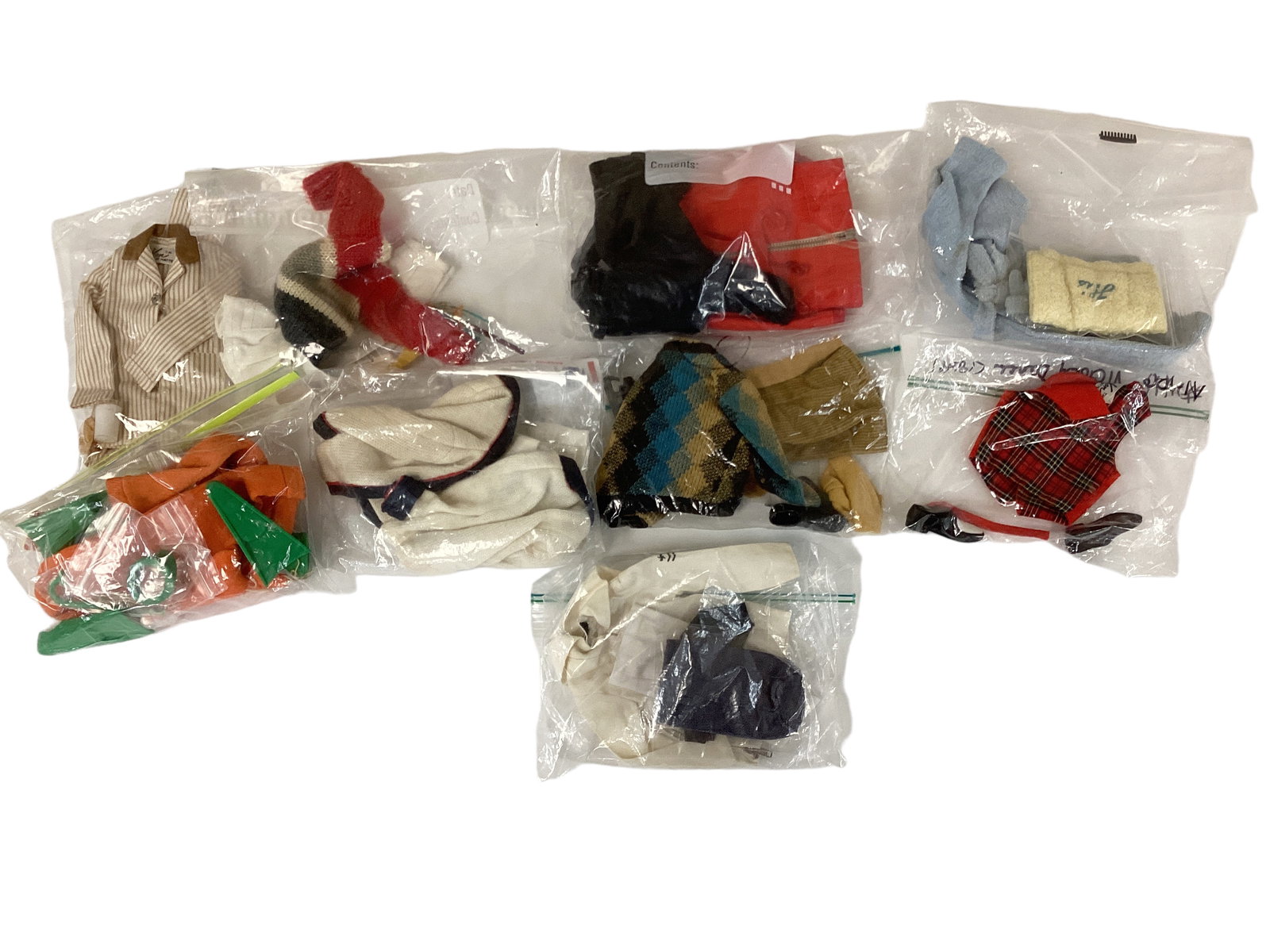 Mix of Clothing for Ken: Mix of Clothing for Ken Includes pieces from Terry Togs, Sleeper Set, Skin Diver & others. Diving masks will need new string, white pants have small marks.