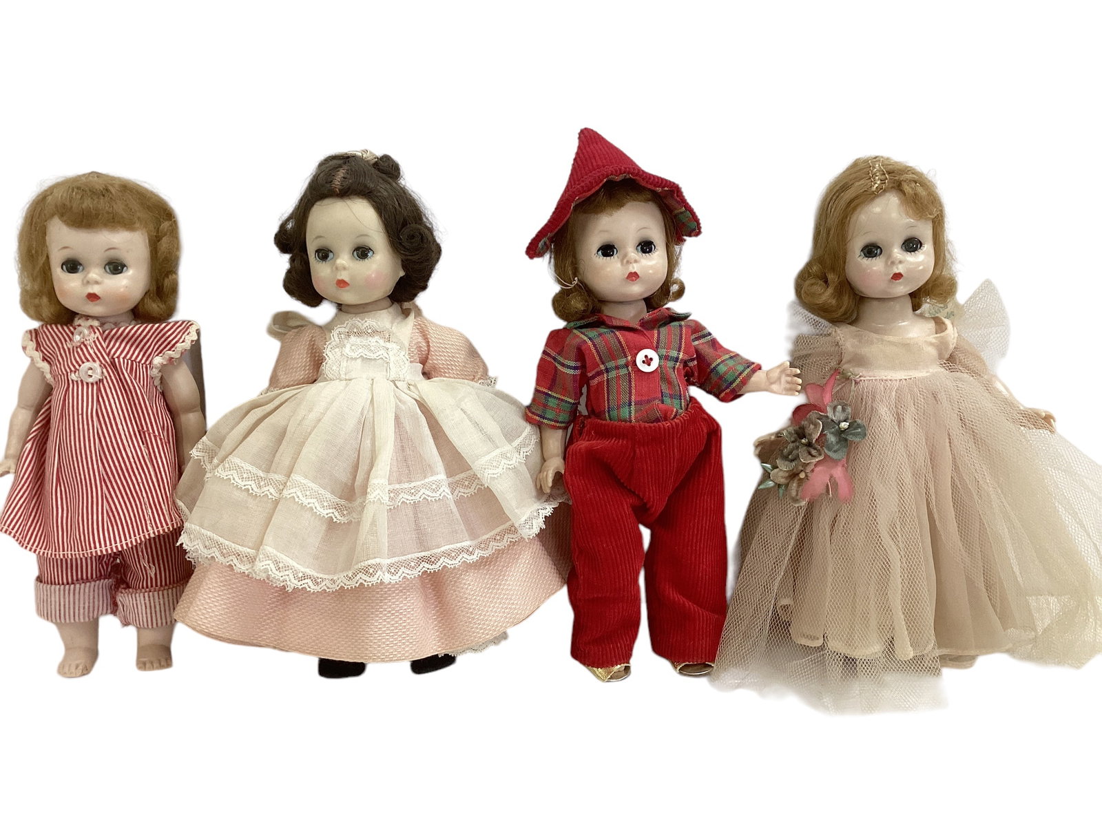 (4) Madame Alexander "Alexander-Kins".: (4) Madame Alexander "Alexander-Kins". 7 1/2" dolls includes Wendy Bridesmaid straight-leg walker, Wendy straight-leg walker in red/white strip pajamas, Little Women Beth bend-knee walker, and Wendy-K