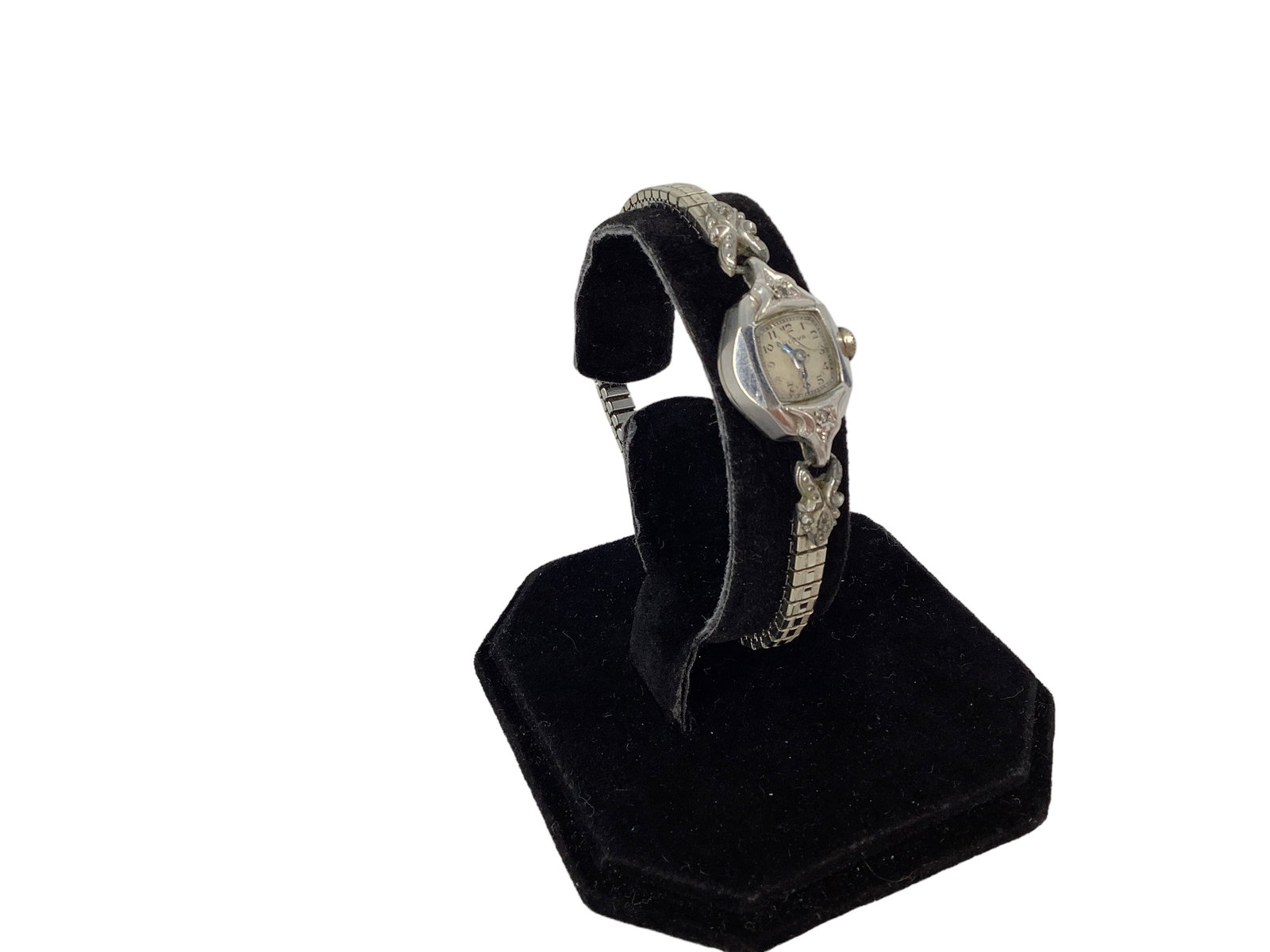 Gold-Filled Ladies Bulova Watch: Gold-Filled Ladies Bulova Watch Ladies watch by Bulova is done in marked white gold-filled metal with a base-metal Speidel stretch bracelet, crystal is broken. There are tiny single cut diamond melee