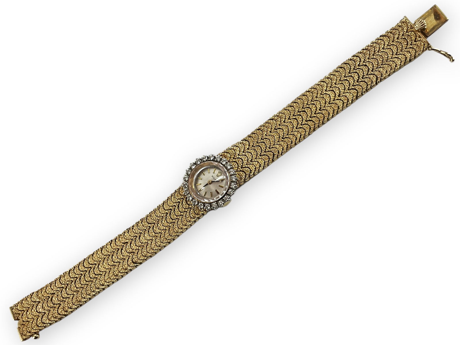 Rolex Cal. 1400 Ladies' Gold Wrist Watch with Diamonds: Rolex Cal. 1400 Ladies' Gold Wrist Watch with Diamonds Stamped and tested 14kt yellow gold, 38.0 grams total weight with movement removed, 6.75" in total length with gold mesh bracelet, Swiss made Rol