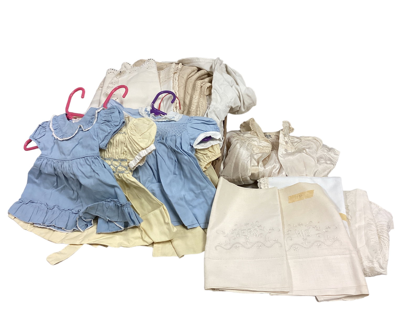 Collection of Vintage Cotton Apparel, and More: Collection of Vintage Cotton Apparel, and More Lot including his & hers pillowcases, baby dresses, table cloths, table runners, silk robe for baby, and more.