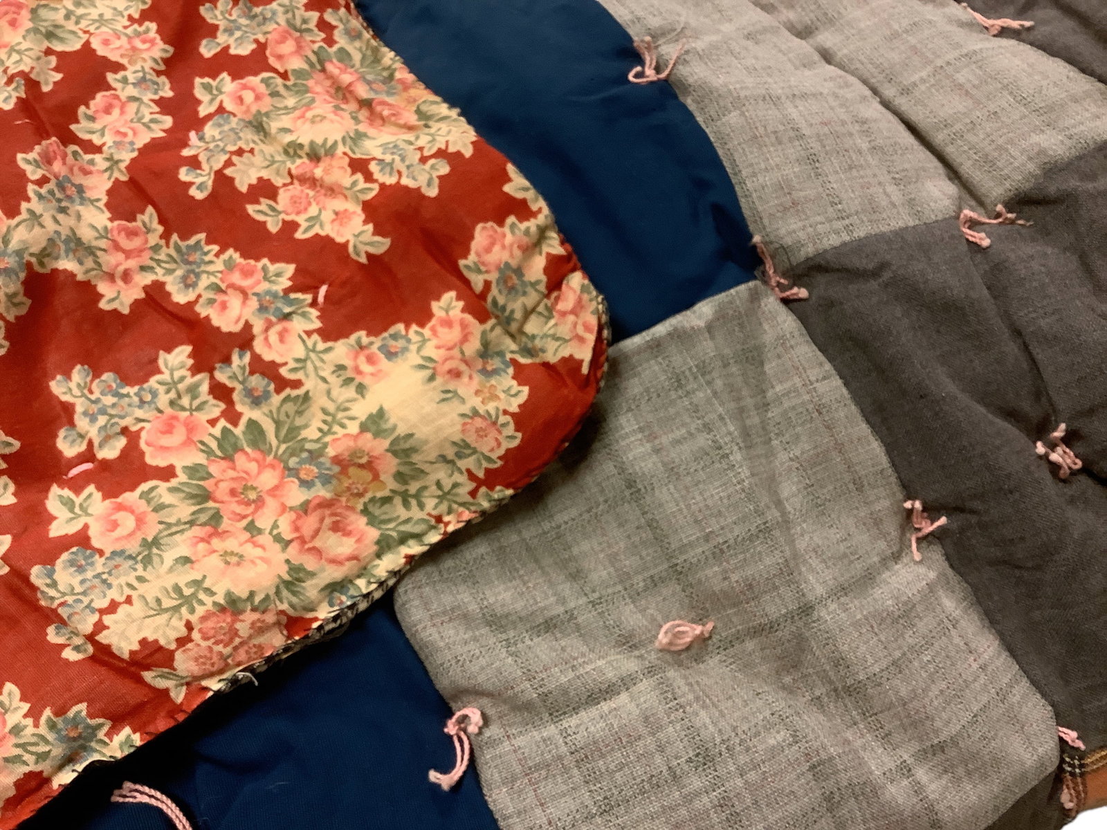 Vintage Reversible Tied Quilt: Vintage Reversible Tied Quilt Vintage reversible quilt. Multiple colors and prints. The quilt measures approximately 73".