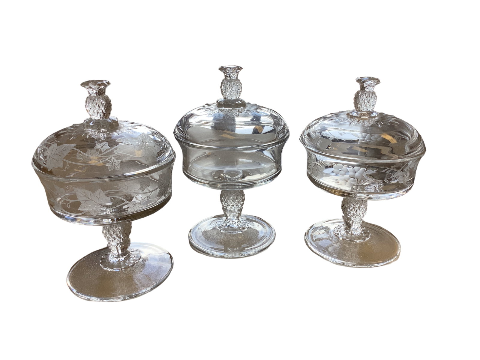 Heisey Plantation 5" Covered Candies: Heisey Plantation 5" Covered Candies Heisey #1567 Plantation 5" Footed Covered Candy (1) plain H. (1) Flower and leaf cutting H. (1) With ivory etched H.
